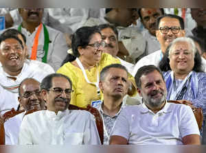 India's Congress party leader Rahul Gandhi (front R) and Indian politician Uddhav Thackeray (front L) react during their election campaign rally ahead of the country's upcoming national elections in Mumbai on March 17, 2024.