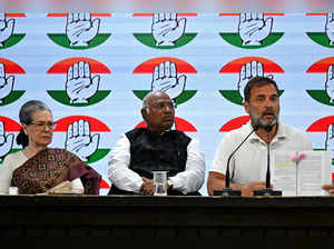 India's Congress party president Mallikarjun Kharge (C) with party leaders Sonia Gandhi (L) and Rahul Gandhi (R) address a press conference at the Congress party headquarters in New Delhi on March 21, 2024.