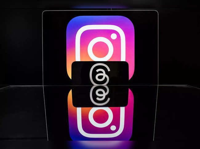 This photograph taken on March 7, 2024 in Nantes, shows the logo of US social media platform Instagram (Top) and US social media platform Threads, both of US company Meta.