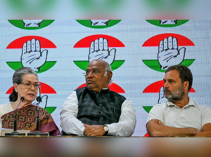 Congress party president Mallikarjun Kharge (C) with party leaders Sonia Gandhi (L) and Rahul Gandhi (R)
