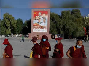 China holds 65th-anniversary celebrations of its Tibet takeover in new villages along India and Bhutan borders