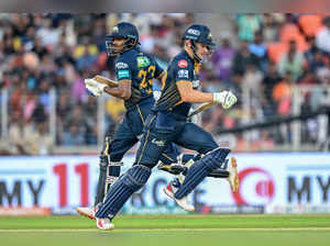 Gujarat Titans' David Miller and Sai Sudharsan (L) run between the wickets during the Indian Premier League (IPL) Twenty20 cricket match between Gujarat Titans and Sunrisers Hyderabad at the Narendra Modi Stadium in Ahmedabad on March 31, 2024.