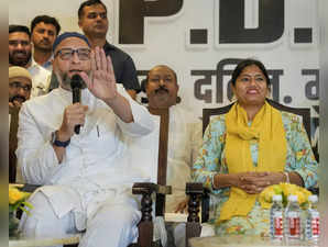 Lucknow: AIMIM chief Asaduddin Owaisi and Pallavi Patel of Apna Dal (K) during a...