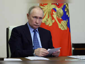 FILE PHOTO: Russian President Putin chairs a meeting via video link at a residence outside Moscow