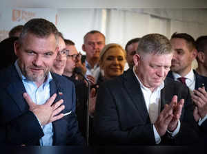 Presidential candidate Peter Pellegrini (L) and Slovak Prime Minister Robert Fico (R) speak to journalists after the announcement of Pellegrini's victory in the second round of the Slovak presidential elections, April 6, 2024 in Bratislava, Slovakia.