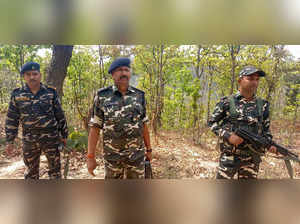 Hazaribagh: Security Forces personnel patrol in the dense forest area of Dumru v...