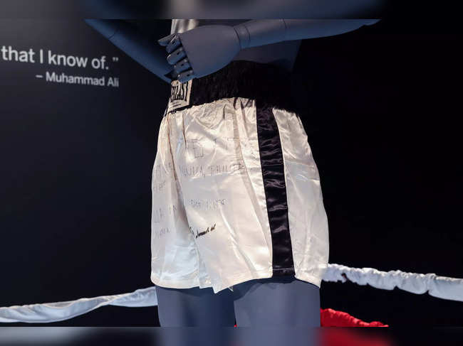 Muhammad Ali's boxing trunks from the 1975 'Thrilla in Manila' boxing match with Joe Frazier stand on display at Sotheby's auction house in New York City