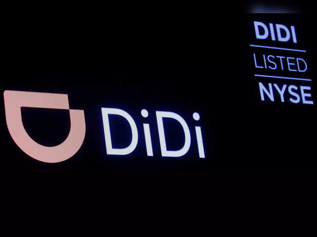 FILE PHOTO: A screen displays trading information for ride-hailing giant Didi Global on the floor of the NYSE in New York
