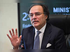 Pakistan Finance Minister Muhammad Aurangzeb gestures while speaking with media representatives at the finance ministry in Islamabad on March 22, 2024.