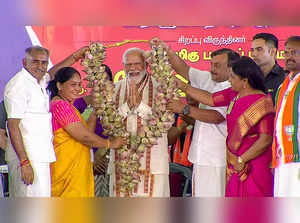 Coimbatore, Apr 10 (ANI): Prime Minister Narendra Modi being felicitated during ...