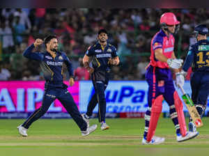 Jaipur: Gujarat Titans' Rashid Khan celebrates the wicket of Rajasthan Royals' J...