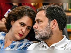 India's Congress party leader Rahul Gandhi along with his sister Priyanka Gandhi Vadra (L) looks on as he waits to file his nomination papers for the upcoming general elections, in Wayanad on April 3, 2024.