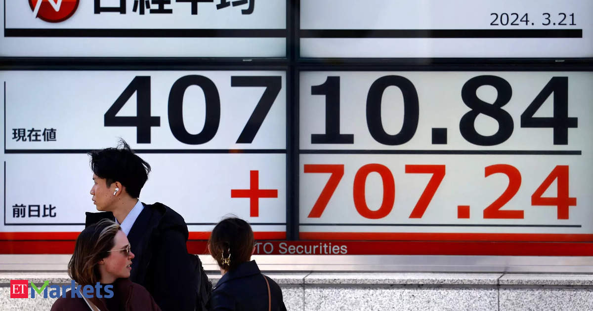 Japan’s Nikkei falls as bond yield spike sinks tech, property shares