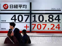 Japan's Nikkei falls as bond yield spike sinks tech, property shares