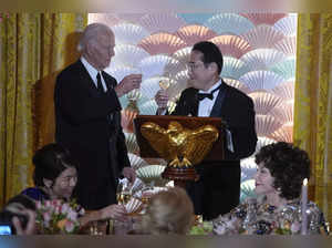 President Joe Biden and Japanese Prime Minister Fumio Kishida toast during a Sta...