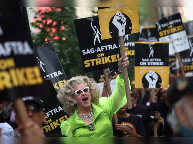 SAG-AFTRA and WGA strikers picket in New York