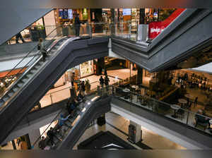 People use the escalators in a shopping mall in Buenos Aires on April 12, 2024.