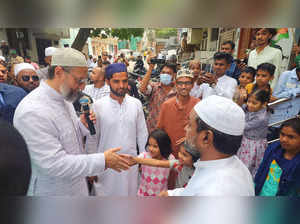 Hyderabad: AIMIM President Asaduddin Owaisi during his door-to-door election cam...