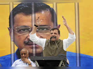 New Delhi: AAP leader Sanjay Singh speaks during a protest against the arrest of...