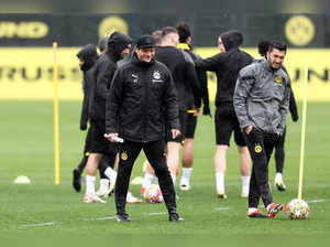 Dortmund's German head coach Edin Terzic and assistant coach Nuri Sahin attend a training session on the eve of their UEFA Champions League quarter-final second leg football match against Atletico Madrid at the club's training ground in Dortmund, western Germany on April 15, 2024.