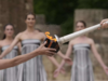 Despite weather glitch, the Paris Olympics flame is lit at the Greek cradle of ancient games