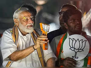 Chennai: Prime Minister Narendra Modi acknowledges supporters during a roadshow ...