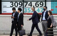 Asian shares mixed as Fed's Powell rethinks rate cuts, yields jump