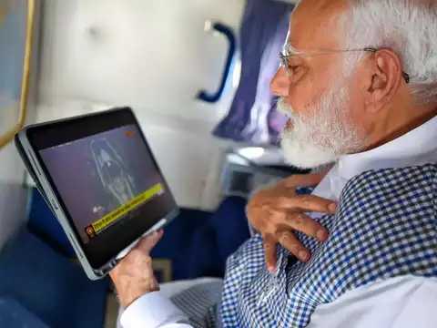 PM Modi watches on