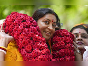 Chennai: Union Minister and BJP leader Smriti Irani being garlanded during an el...