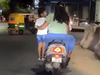 Bengaluru couple fined for riding scooter with child standing footrest, video goes viral