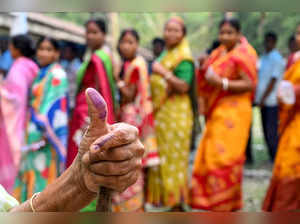 A woman shows her inked finger after casting her ballot to vote in the first phase of India's general election at a polling station in Kalamati village, Dinhata distict of Cooch Behar in the country's West Bengal state on April 19, 2024.