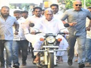 Watch Puducherry CM Rangasamy rides Yamaha RX100 motorcycle to reach polling booth in Delarshpet