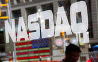 Nasdaq, S&P tumble as Netflix, chip stocks drag; AmEx boosts Dow