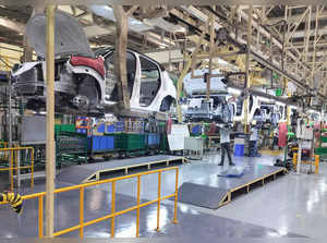 Employees work at the manufacturing plant of Renault Nissan Automotive India in Oragadam