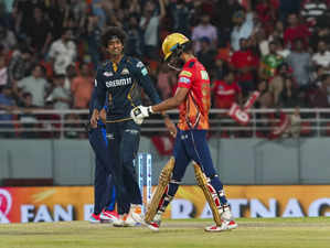 Mohali: Gujarat Titans' Sai Kishore celebrates the wicket of Punjab Kings’ Harpr...