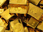 Gold edges higher; hovers near one-week low on tempered Middle East fears