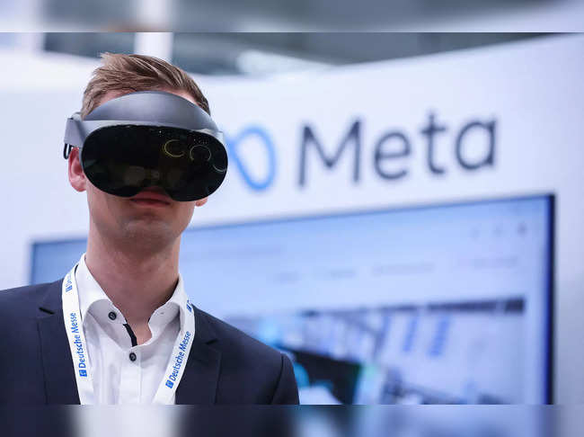 A visitor tests Meta Quest Pro goggles at the booth of Meta Platforms at the Hanover technology Fair on April 22, 2024 in Hanover, northern Germany, with Norway as partner country.