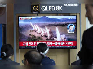 A TV screen shows a file image of North Korea's missiles launch during a news pr...