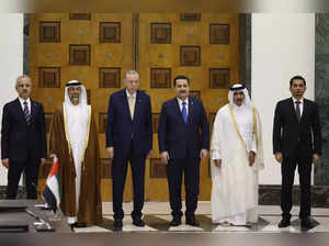 Turkish President Tayyip Erdogan,  centre left Iraqi Prime Minister Mohammed Shi...