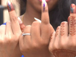 Woman Collector meets people in buses, shops, urges them to vote on election day in Kerala