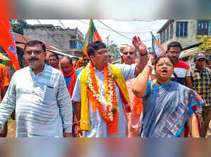 Birbhum: BJP candidate and former IPS Officer Debashish Dhar waves to supporters...