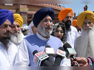 Shiromani Akali Dal Party candidate for Gurdaspur Dr Daljit Singh Cheema (C) speaks to the media before paying his respects at the Golden Temple in Amritsar on April 16, 2024, ahead of India's upcoming general elections.