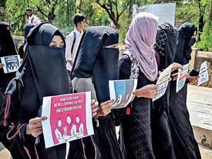 Muslim girls protest against the Karnataka High Court's verdict by boycotting their internal exams in front of IDSG college, in Chikkamagaluru, on Wednesday.