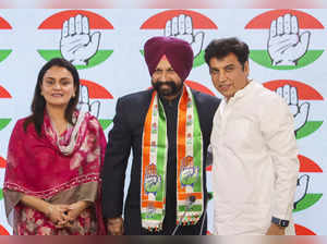 New Delhi: Congress leader Devender Yadav with newly joined party leader and for...