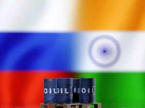 FILE PHOTO_ Illustration shows oil pump jack, Russian and Indian flags.