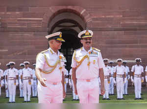 New Delhi: Admiral Dinesh Kumar Tripathi (R) with outgoing Navy Chief Adm R. Har...