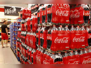 FILE PHOTO: Bottles of Coca-Cola are displayed at a supermarket in Glattbrugg, Switzerland June 26, 2020.