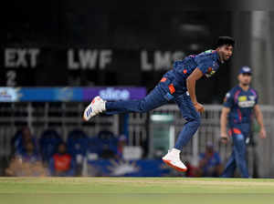 Lucknow Super Giants' Mayank Yadav delivers a ball during the Indian Premier League (IPL) Twenty20 cricket match between Lucknow Super Giants and Mumbai Indians at the Ekana Cricket Stadium in Lucknow on April 30, 2024.