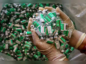 Jammu: A healthworker shows empty vials of Covishield vaccine at a vaccination c...