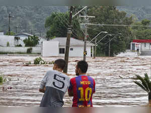 People observe a flooded street after heavy rains in Encantado, Rio Grande do Sul, Brazil on May 1, 2024.